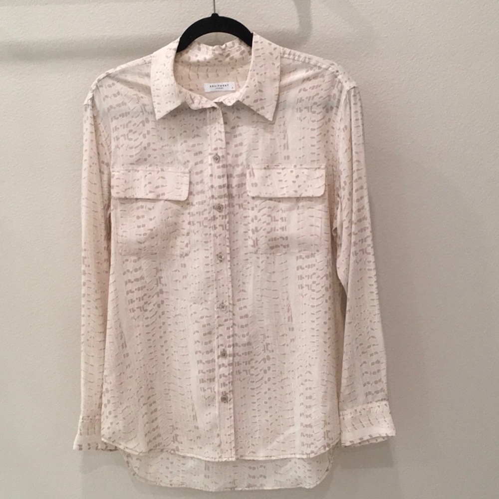 Women’s long sleeve silk button down top.